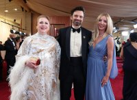 Sebastian Stan and Annabelle Wallis pose with his mother in 2025 Oscars